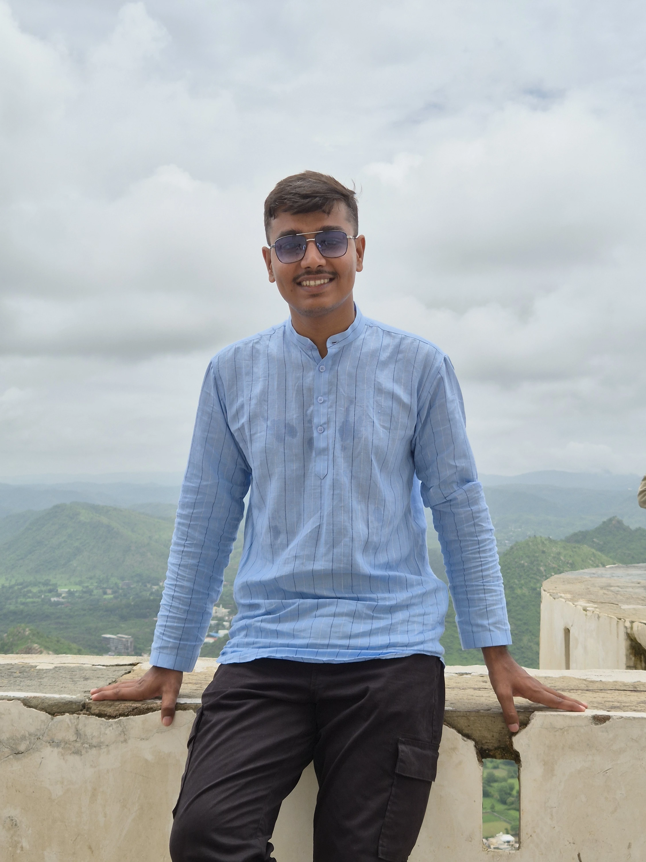 Amit on a hilltop in casual wear